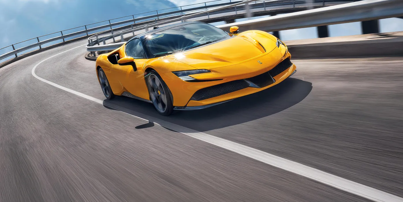 Yellow Ferrari SF90 on a racetrack